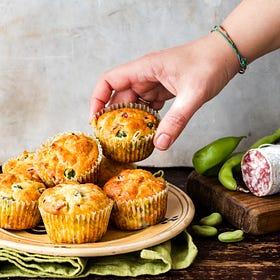 A recipe for a Spring picnic: muffins with fava beans, salami, and pecorino