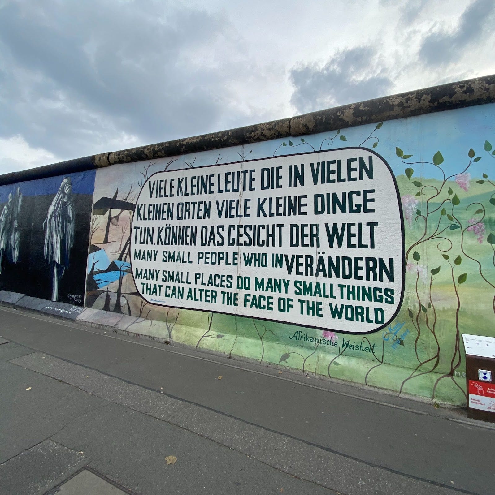 Photo of street art quote on Berlin Wall