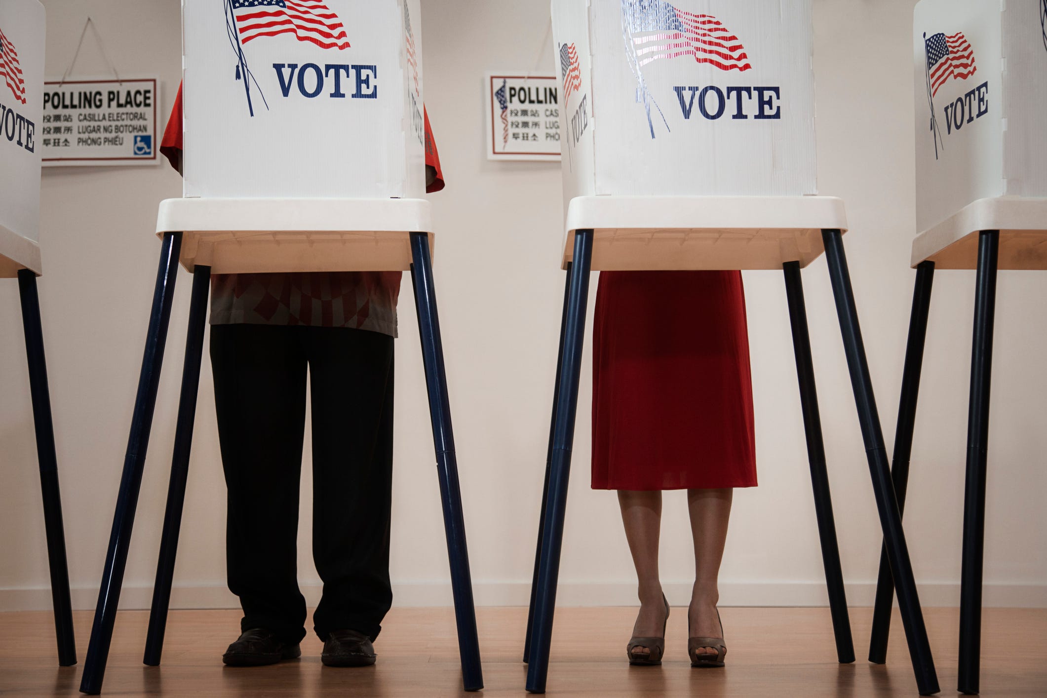 A man and woman vote.