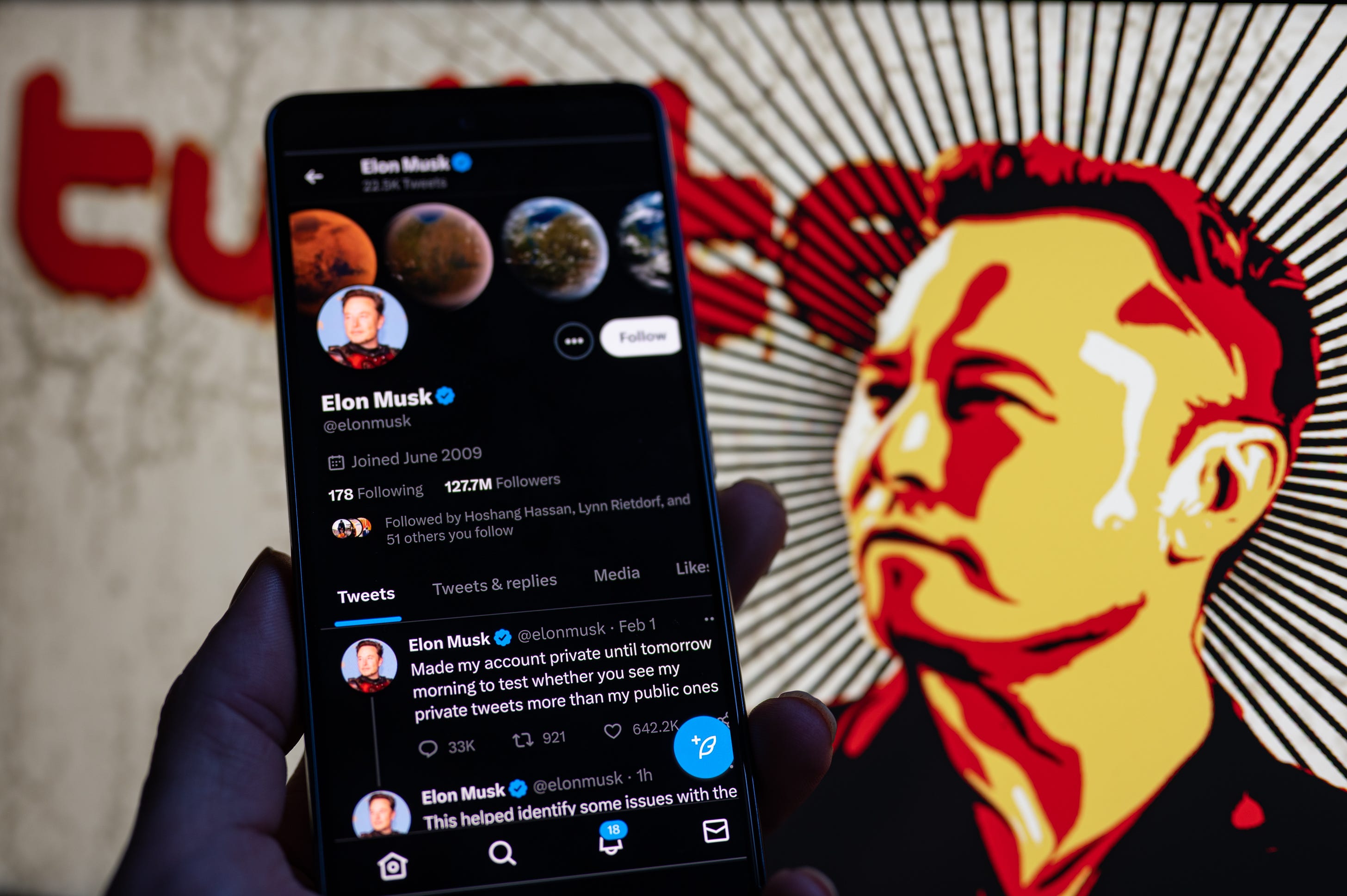 Elon Musk Twitter account private page seen on Mobile with Elon Musk in the background on screen. On 2 February 2023 in Brussels, Belgium. (Photo Illustration by Jonathan Raa/NurPhoto via Getty Images)