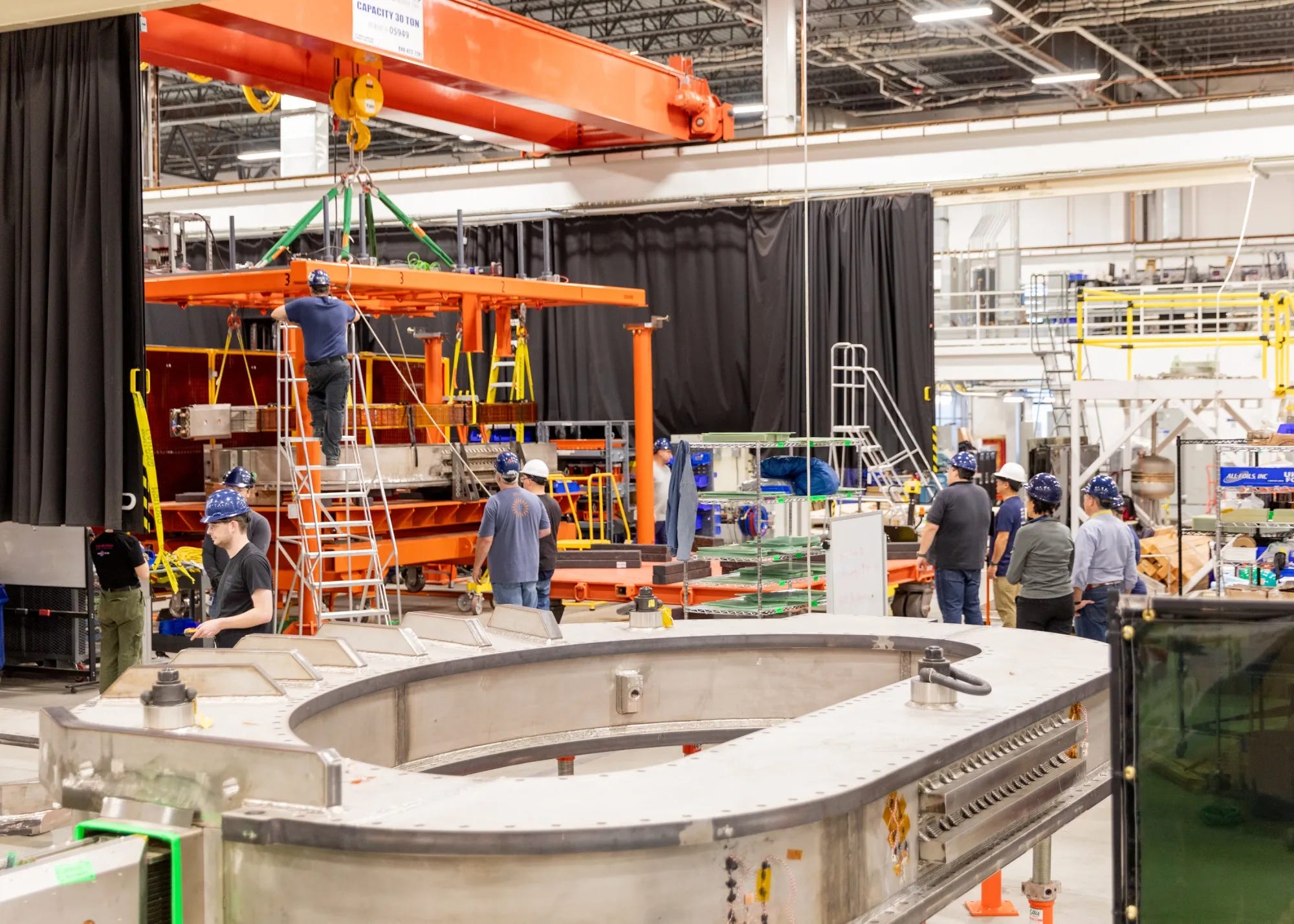 Workers at the Commonwealth Fusion Systems campus in Devens, Massachusetts.