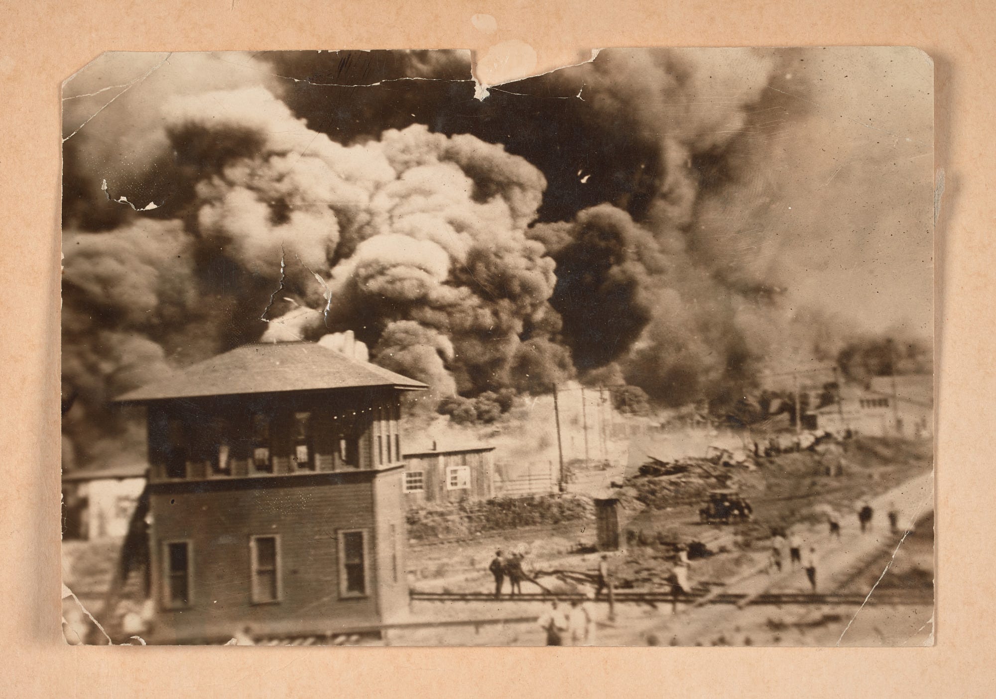 Photograph of the Greenwood District burning during the Tulsa Race Massacre Photograph of the Greenwood District burning during the Tulsa Race Massacre