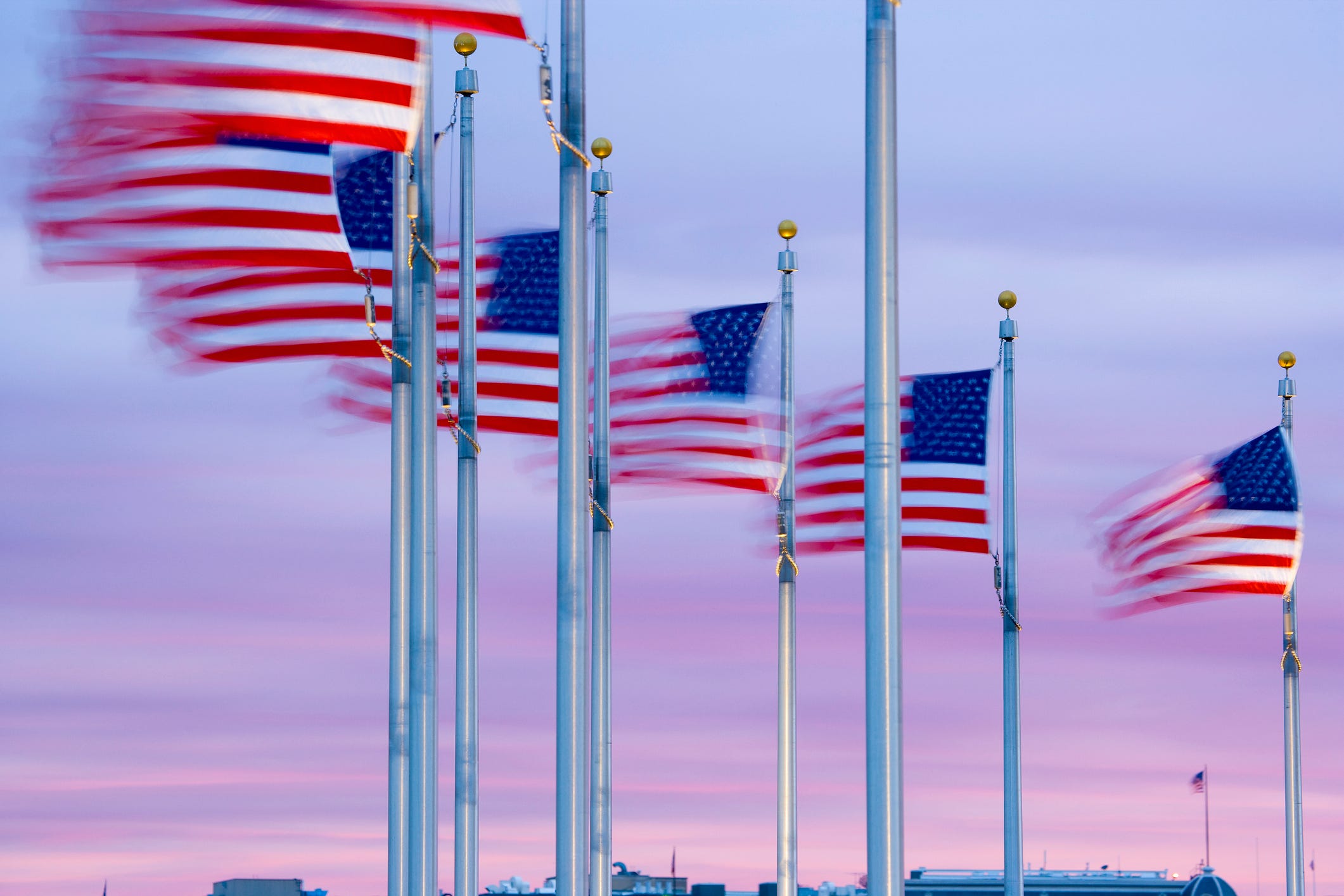 American flags waving at dawn