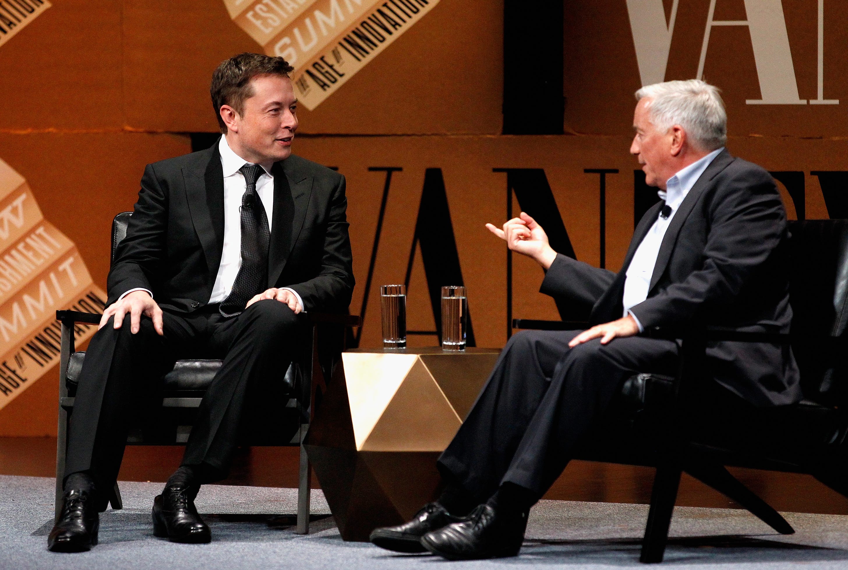 Walter Isaacson interviews Elon Musk in San Francisco in 2014. (Michael Kovac / Getty Images)