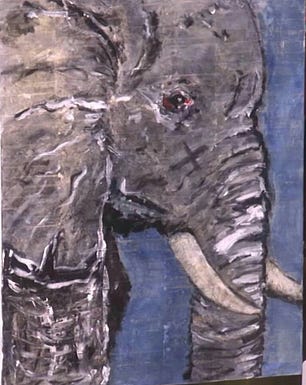 A rudimentary painting of an elephant's head, trunk, tusks, and ears in profile. It looks like it was made by a child.
