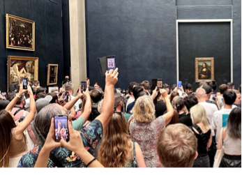 A group of people looking at a painting Description automatically generated A group of people looking at a painting Description automatically generated