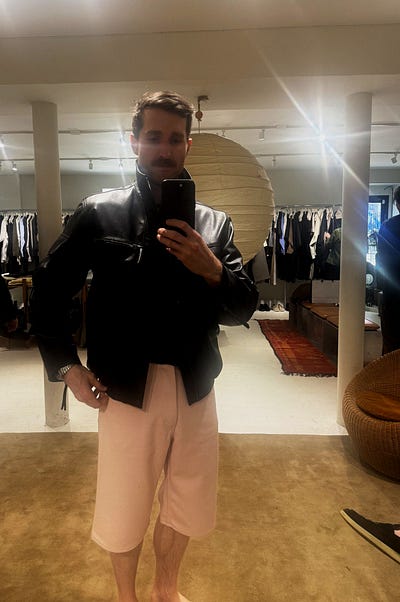 Trying on the Lemaire coat at Ven Space in May