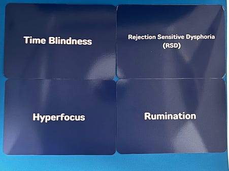 4 cards each titled: Time Blindness, Rejection Sensitive Dysphoria, Hyperfocus, and Rumination 4 cards each titled: Time Blindness, Rejection Sensitive Dysphoria, Hyperfocus, and Rumination