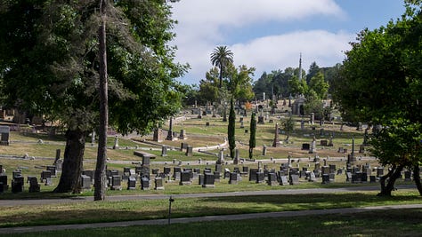 Photo 1: Tom pedals his bicycle up a steep hill in Mountain View Cemetery. Photo 2: A wide-angle photo of Mountain View Cemetery with headstones in the foreground, a handful of trees in the middle ground, and more trees and headstones in the distant background. Photo 3: The imposing white marble facade of a mausoleum at the Mountain View Cemetery.