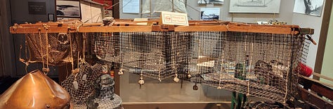 fish trap, a model of a fish trap, a pile of fish