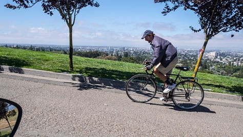 Photo 1: Tom pedals his bicycle up a steep hill in Mountain View Cemetery. Photo 2: A wide-angle photo of Mountain View Cemetery with headstones in the foreground, a handful of trees in the middle ground, and more trees and headstones in the distant background. Photo 3: The imposing white marble facade of a mausoleum at the Mountain View Cemetery.