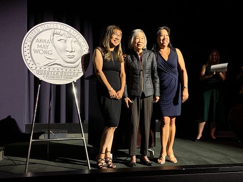 Three photos from the AMW quarter launch: Anna and Amy Wong with their mother next to a giant AMW coin; the entrance to Paramount Pictures; Katie at the podium introducing Shanghai Express