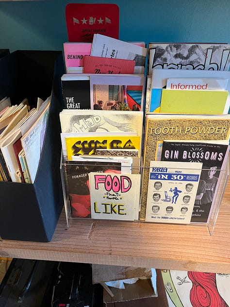 Interior shots  of the print studio and lab, with examples of some publication from their zine library. 