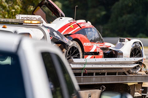 Porsche 963 GTP car, wrecked race car, tow truck