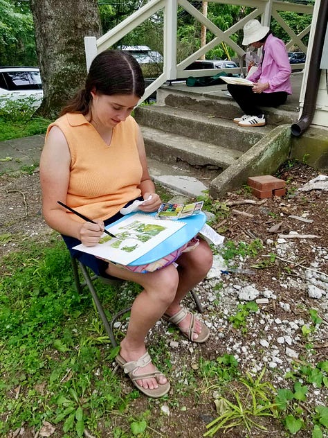 Three photos of artists sketching in a rural setting outdoors. Two areas working on a lapboard, and one is using an upright easel.