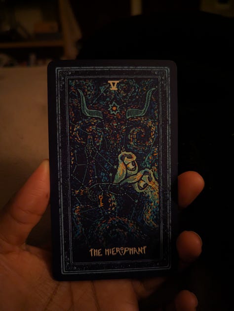 Tarot cards that read: The Hanged Man, The Emperor, The Hierophant 