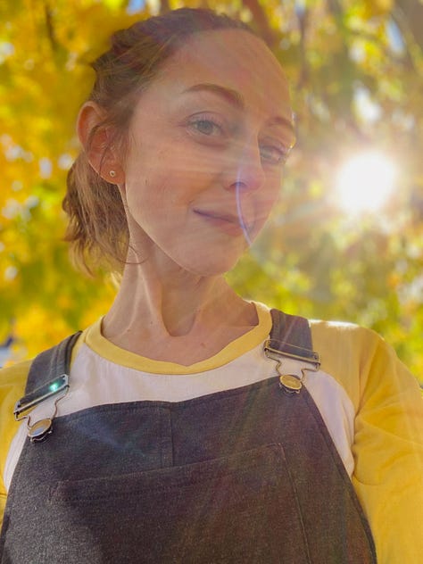 1. looking up into the vibrant yellow and green leaves of a tall tree 2. kate, wearing a yellow-sleeved shirt, standing in the sun under a yellow tree and smiling at the camera 3. closeup of yellow and green leaves, vivid and translucent as stained glass