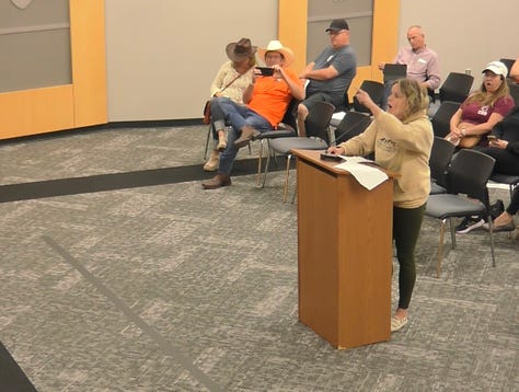 A parent demands district superintendent Theresa Williams look at her while she complains about books in Plano ISD