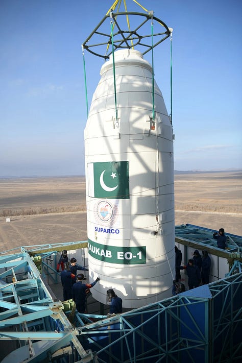 Vehicle hardware for the Long March 2D Y101 mission being transported to and stacked on the launch pad.