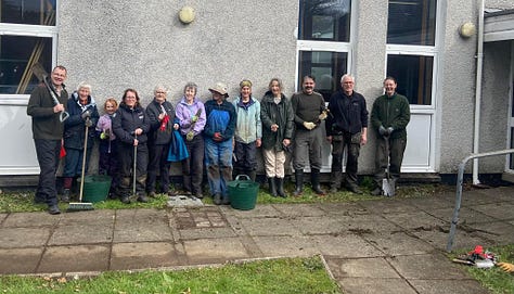 Volunteers working outside the village hall