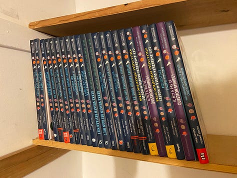 A poster advertising my visit to a school, a shelf of international versions of There's No Such Thing As A Silly Question, posing inelegantly on a bin