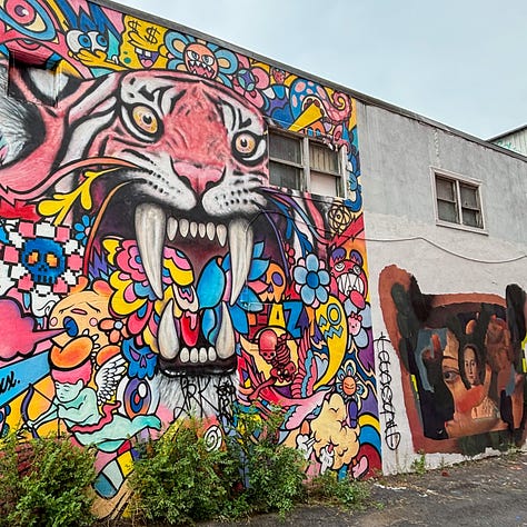 Six colorful murals painted on city buildings