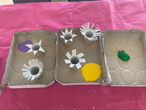 Photos of cardboard tubes snipped at the ends to create flower shapes ready to dip into paint