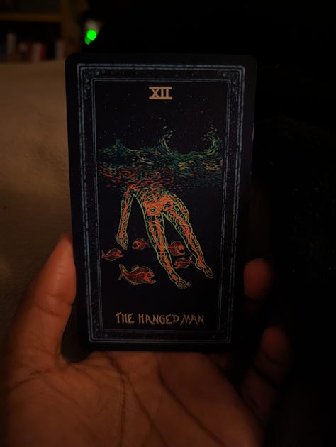 Tarot cards that read: The Hanged Man, The Emperor, The Hierophant 