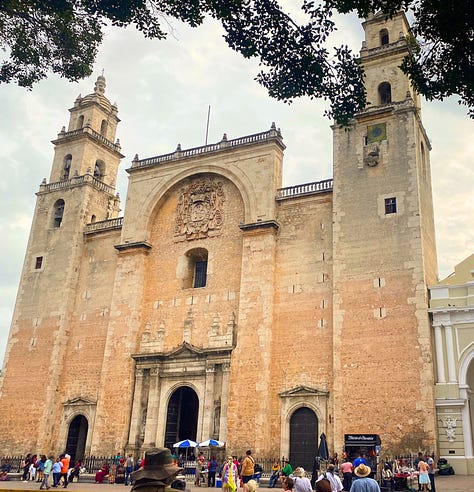 The cathedral's imposing exterior, a door knocker, cathedral interior, statue with pigeon, floor tile