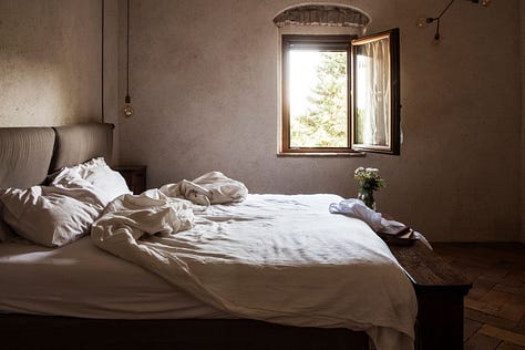 Minimalist styled bedrooms with beautiful refurbished vintage furniture. terracotta tiles and hand-sewn linens