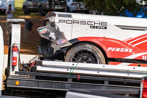 Porsche 963 GTP car, wrecked race car, tow truck