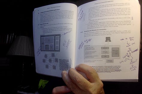 3 photos of me holding books on crypto programming with my handwritten notes on them.