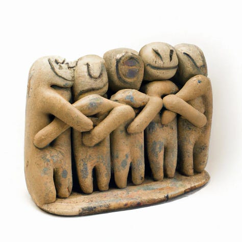 sculptures of people hugging 