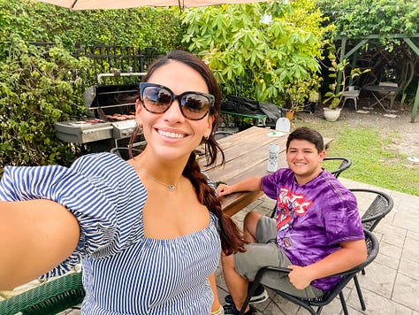 Photo of a lush tropical garden in front of a building, selfie photo of a woman and her dog, mirror selfie of a woman touching her baseball cap with the Miami Heat basketball logo, selfie of a woman smiling