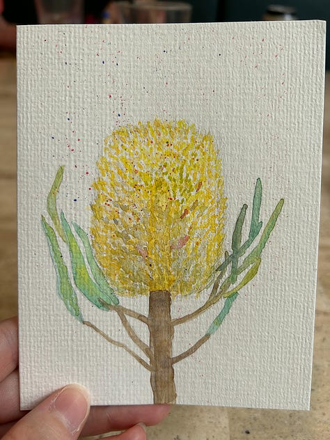Three images, each with a watercolour/gouache painting. The first is of a yellow banksia flower, the second is a smiling rabbit with flowers in its hair, and the third is a koala clutching a tree branch.
