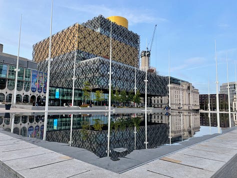 Various pictures of transport in the UK's second city. They include trams, excellent public spaces, hire bikes, Birmingham New Street Station, and Black Sabbath