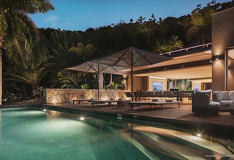 Aerial view of The Dunes in St. Barths, showcasing its vast estate with two infinity pools, lush tropical gardens, and modern architecture, all nestled near the secluded Saline Beach. The villa’s expansive terraces offer panoramic views of the Caribbean Sea, and the private, elegant interiors provide the ultimate in luxury and comfort.