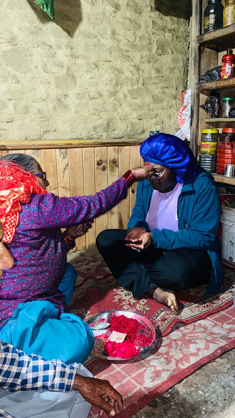 Grandma and grandpa pictured pressing tikka to my forehead.