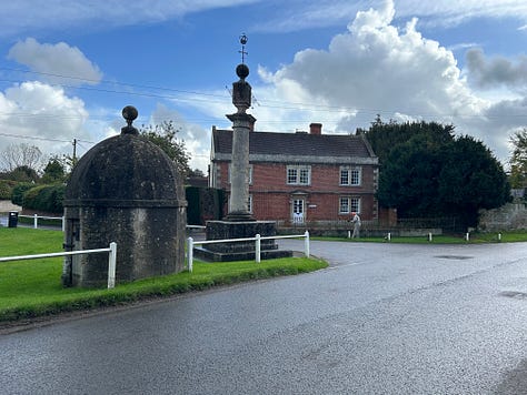 Three photos showing Steeple Ashtom Market Cross and Lock-up from different angles. They are situated on one corner of the village green. Images: Roland's Travels