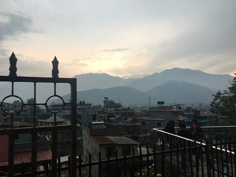 various cities, buildings, hills, lakes with boats, wild rivers, a stupa, the countryside, and the "view" of the Annapurna mountain range