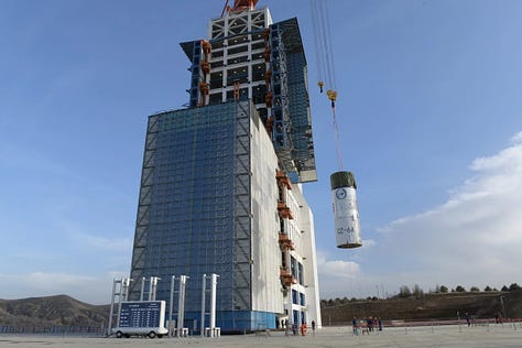 Hardware for the Long March 6A Y22 vehicle being stacked ahead of launch and heading to the launchpad.