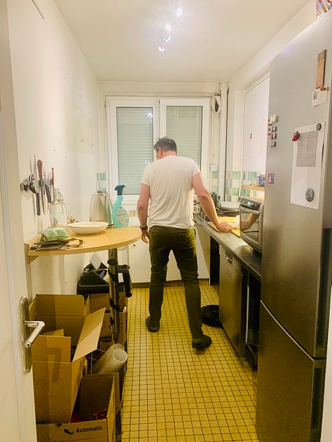 A man does DIY kitchen renovation in a Paris apartment
