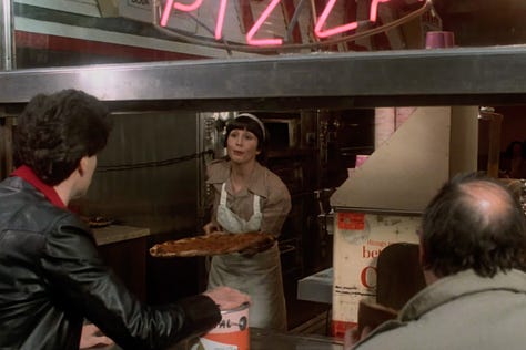 Double Decker Pizza Slices in Saturday Night Fever (1977) with John Travolta walking the streets of Brooklyn | Film Flavor: A Newsletter Surveying Food in Film