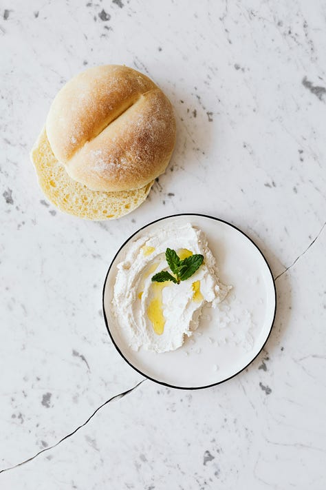 a row of three photos showing Belgian style bread rolls, 1st on a marble background with cream cheese, 2nd in bread basket, 3rth close-up of kaiser bun