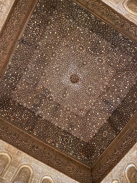 9 photos showing various views of interior parts of the Alhambra. Details of the Islamic calligraphic writing and various patterns carved into the walls.