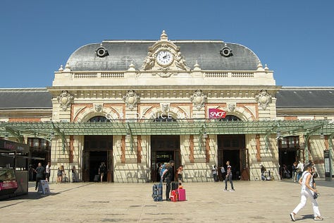 Our piano on the stairs; a stall at the Liberation Market; Nice Ville train station