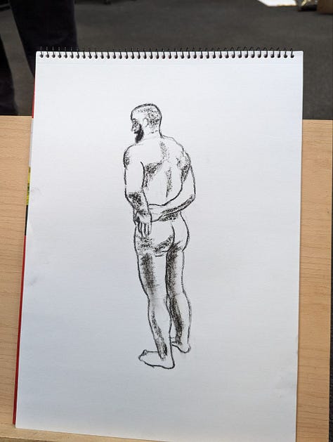 Male life model poses for life drawings