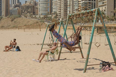 Aline Deschamps' photos of exploited African women enjoying a moment of freedom at the beach in Beirut.