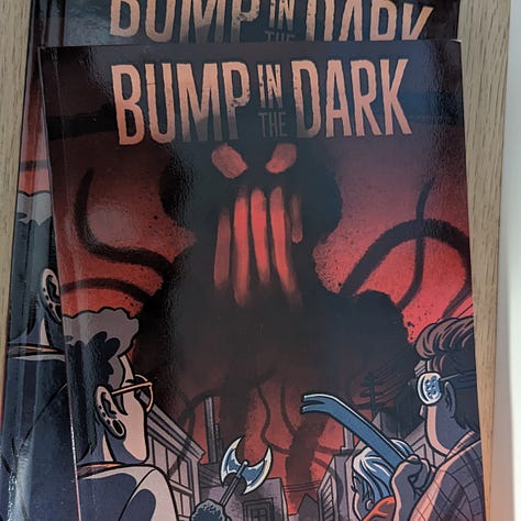 Photos of the print-on-demand version of the TTRPG Bump in the Dark.