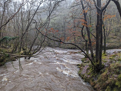 river in spate at Pontneddfechan in the waterfalls area of the brecon beacons